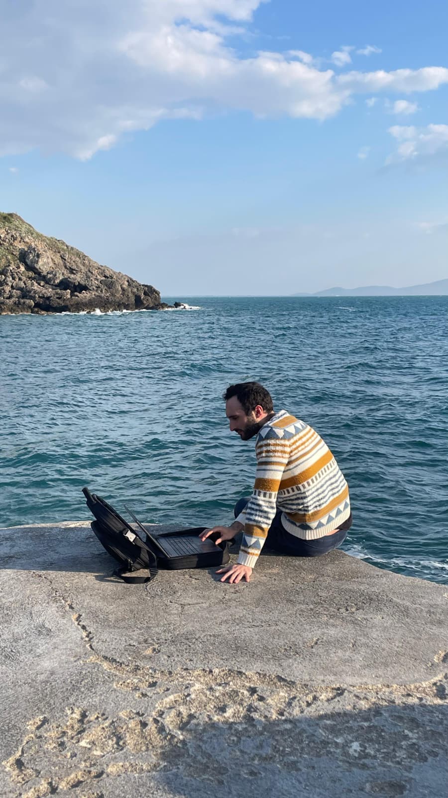 Pablo Fiorentini working by the sea